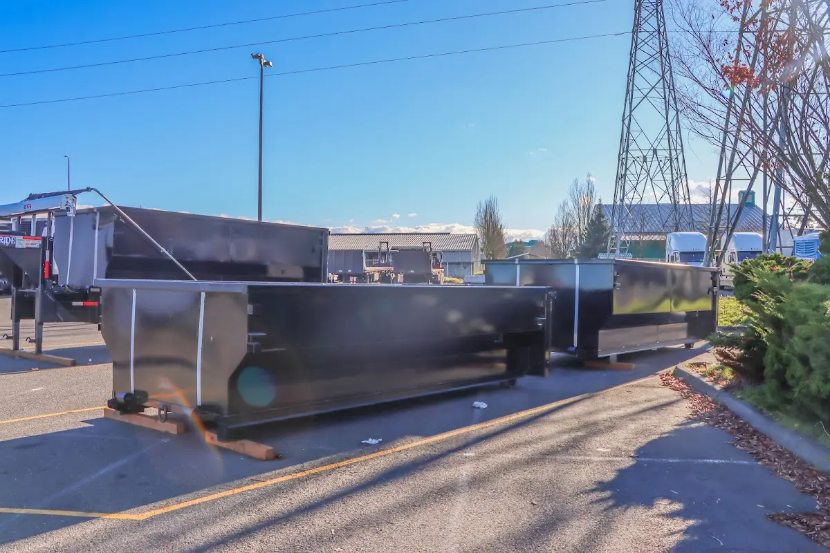 Roll-off dumpster ready for waste disposal at job site for 2 Yard Dumpster Rental in Junction City